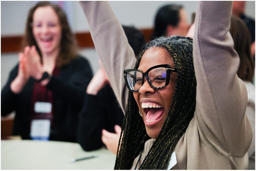Woman celebrating at a corporate event in Kansas City
